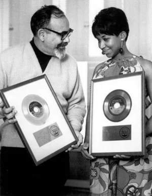 Understanding RIAA Gold Records: Jerry Wexler and  Aretha Franklin displaying her first two RIAA Gold Record Awards for "Respect" and "I Never Loved A Man The Way I Love You" in 1968.