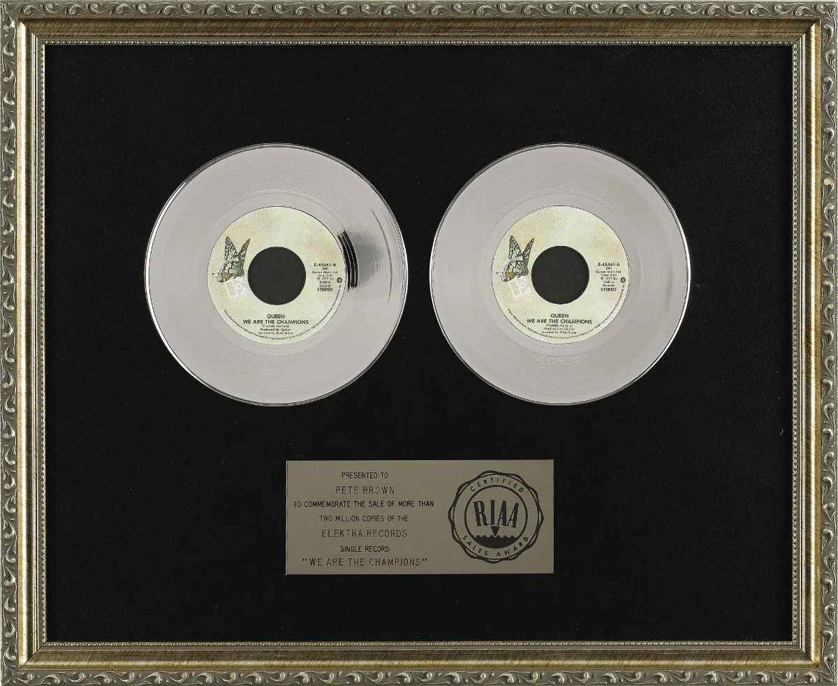 Understanding RIAA Gold Records: RIAA Platinum Record Award for Queen's single "We Are The Champions" from 1977.